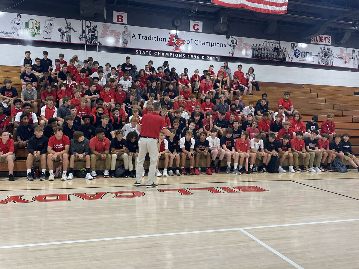 Students in bleachers in the gym